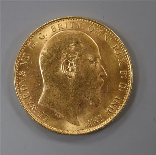 An Edward VII 1910 gold full sovereign.
